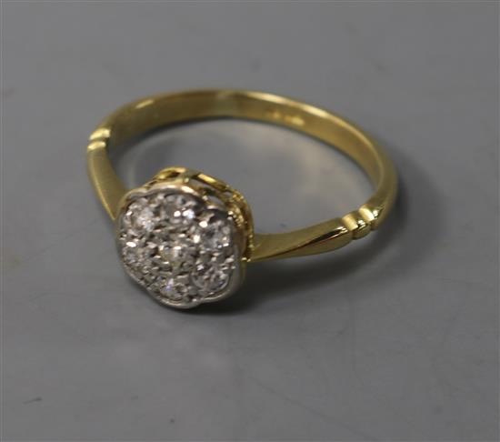 An 18ct gold and diamond cluster ring, size L.